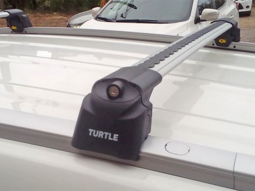 Багажник на крышу Hyundai Tucson 2016-..., Turtle Air 2, аэродинамические дуги на интегрированные рейлинги (серебристый цвет)