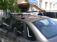 Багажник на крышу Lada Granta, Атлант, аэродинамические дуги "Эконом"